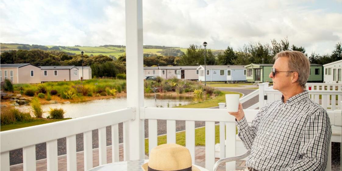 man on veranda in static caravan