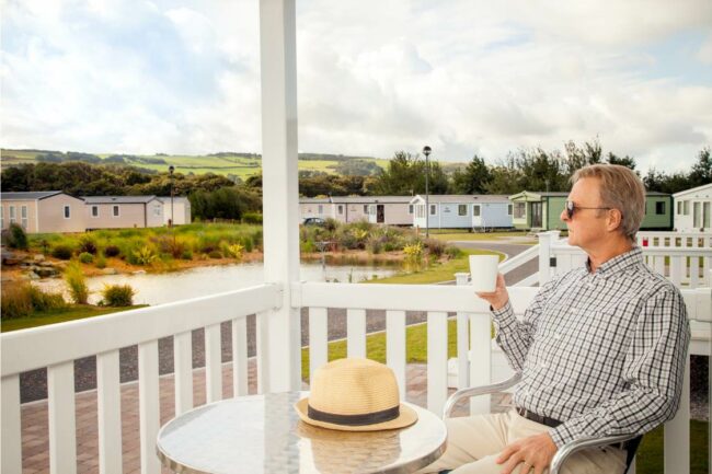 man on veranda in static caravan